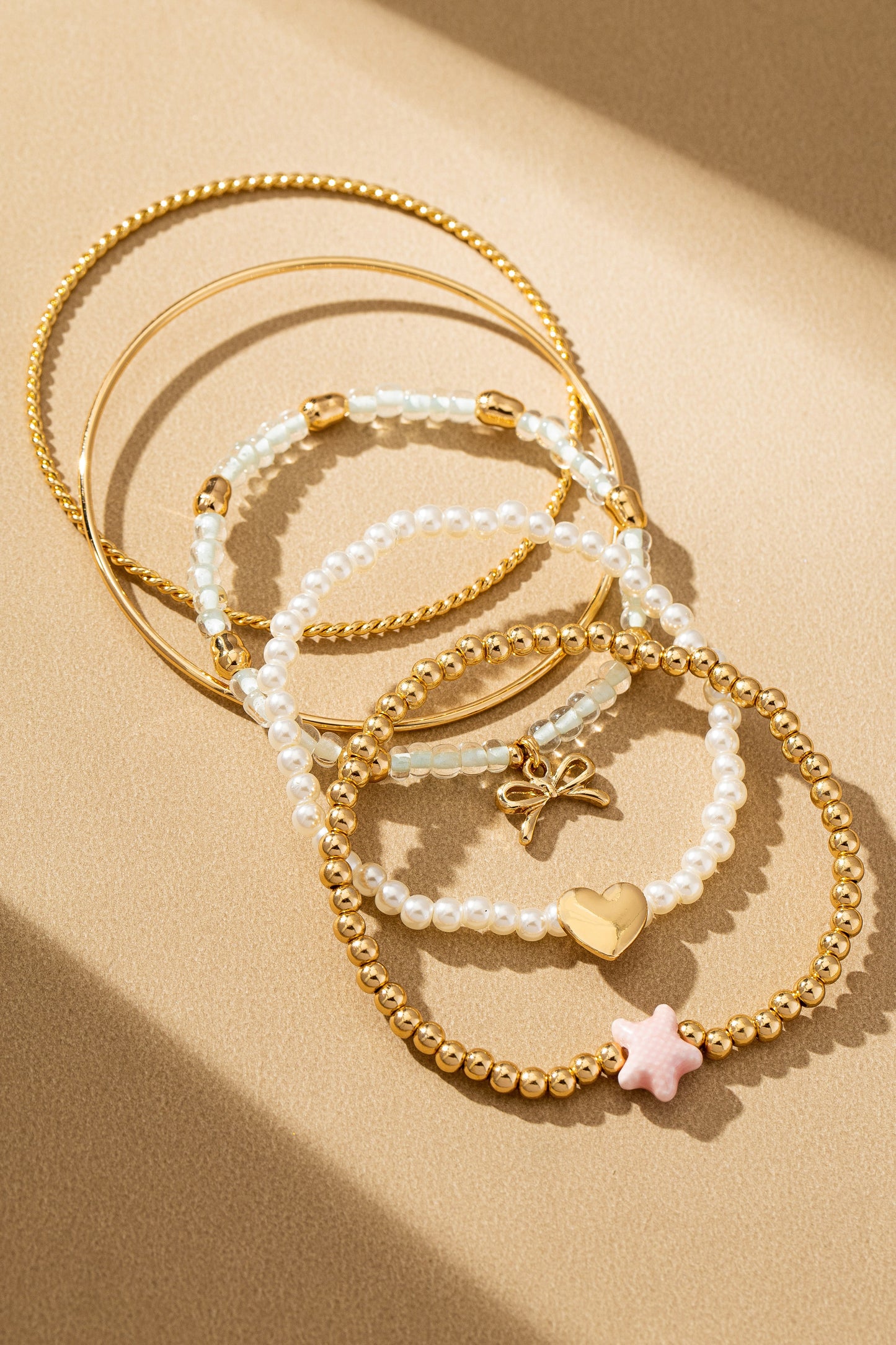 Set Of 5 Ceramic Fish Heart And Bow Bracelets