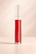 Farmasi LATINA Lip Lacquer in a red-coral shade with an ivory cap, photographed against a warm cream backdrop.